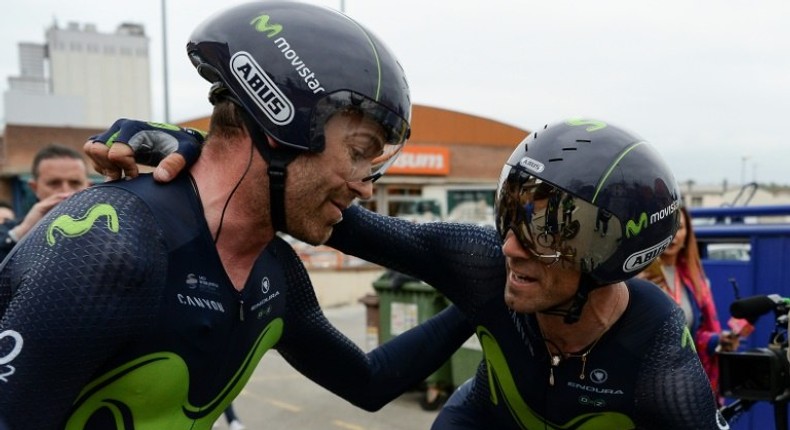 Movistar Spanish rider Alejandro Valverde (R) celebretes with Movistar's Spanish rider Jose Rojas after winning the Team Time Trial on day two of the 97th Volta Catalunya 2017, 41,3 km ride starting and finishing in Banyoles, on March 21, 2017