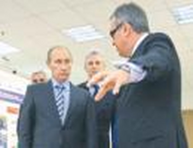 Premier Władimir Putin i szef banku VTB Aleksiej Kostin Fot. AFP
