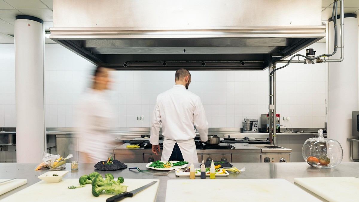 Two professionals chefs cooking together.