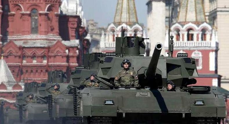 Russian servicemen stand atop T-14 tanks with the Armata Universal Combat Platform during the Victory Day parade, marking the 71st anniversary of the victory over Nazi Germany in World War Two, at Red Square in Moscow