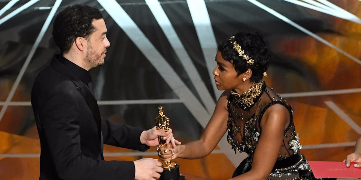 Director Ezra Edelman accepts best documentary feature for "O.J.: Made in America" from singer and presenter Janelle Monae.