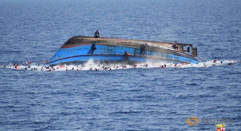 Italy navy says migrant boat flipped, five dead