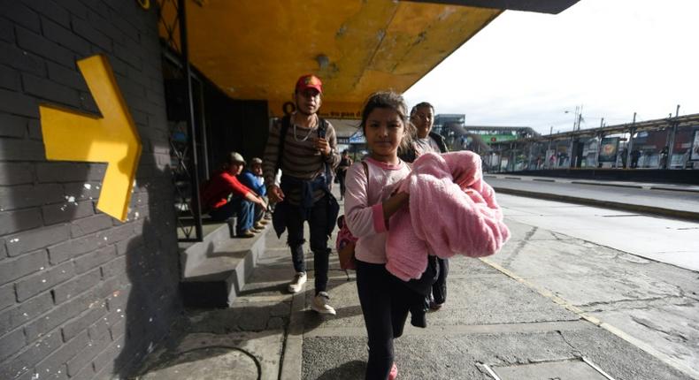 Honduran migrants heading to the United States with a second caravan leave Guatemala City, on January 17, 2019