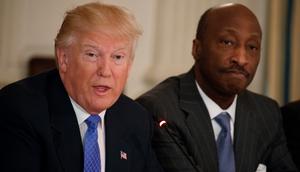 Then-Merck CEO Kenneth Frazier listens at right as then-President Donald Trump speaks during a meeting with manufacturing executives at the White House on February 23, 2017. Frazier resigned from Trump's manufacturing council following then-president's remarks regarding the August 2017 Unite the Right rally.AP Photo/Evan Vucci