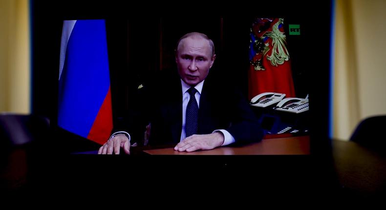 A video of a fake address by Russian leader Vladimir Putin was aired Monday in parts of Russia. This Sept. 21 image shows a laptop screen of Putin's real address that day ordering a partial mobilization.Sefa Karacan/Getty Images