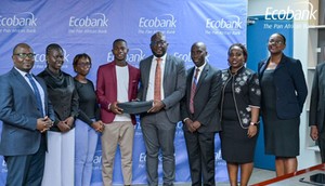 Ecobank Uganda’s Managing Director, Grace Muliisa poses with one of the winning enterprises