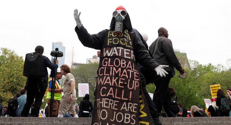 A man wearing a costume stands during a May Day protest in New York, U.S. May 1, 2017.