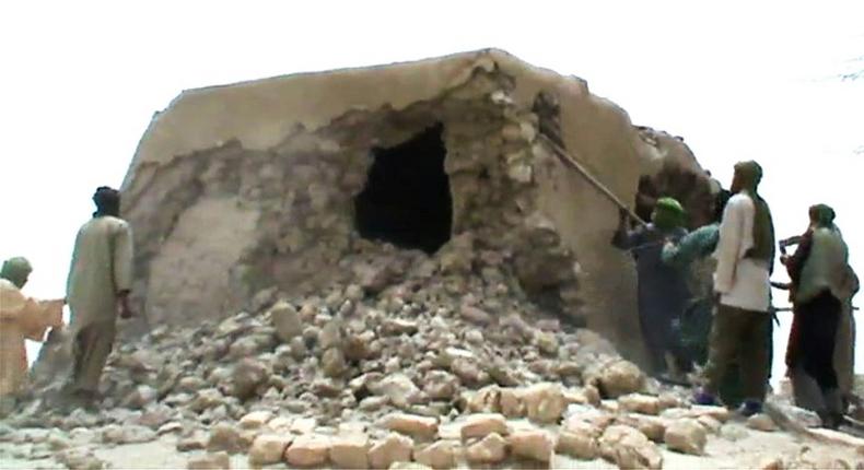 A still from a video shows jihadists destroying an ancient shrine in Timbuktu in 2012