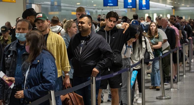 A long queue of travellers seen awaiting their security checks at London's Heathrow Airport on June 1.