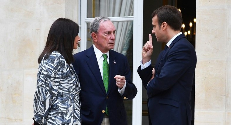 Former New York mayor, Michael Bloomberg, seen here meeting with French President Emmanuel Macron and Paris mayor Anne Hidalgo, leads a group of US business and government leaders pledging continued support for the Paris climate accord