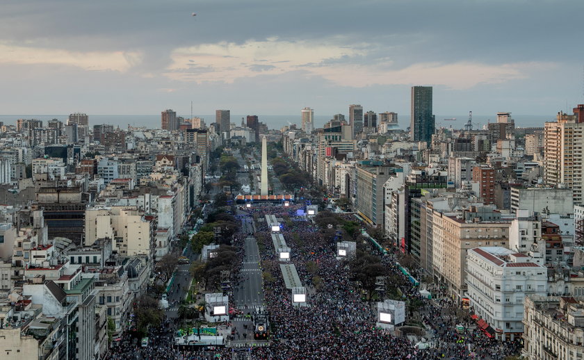Aerial view of the Avenida 9 de Julio and the Obelisk of Buenos Aires as huge crowds fill the street