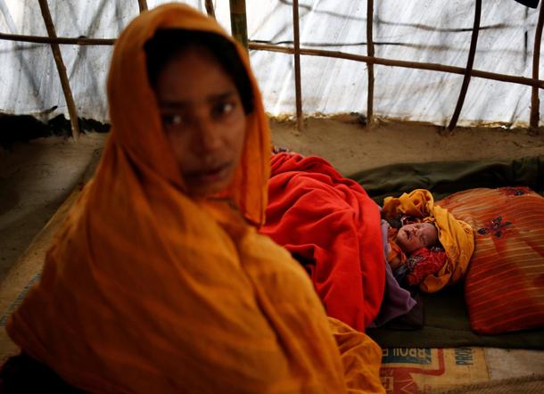The Wider Image: Young Rohingya mothers flee persecution