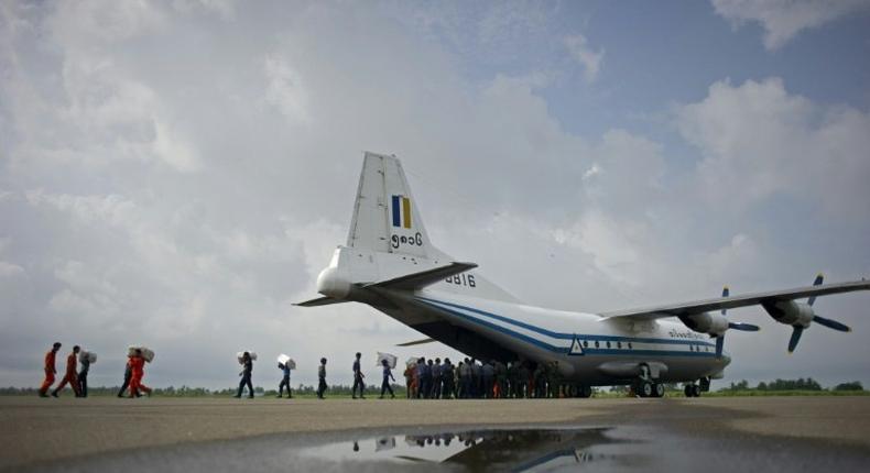 A Shaanxi Y-8 transport aircraft is unloaded at Sittwe airport in Myanmar's Rakhine state