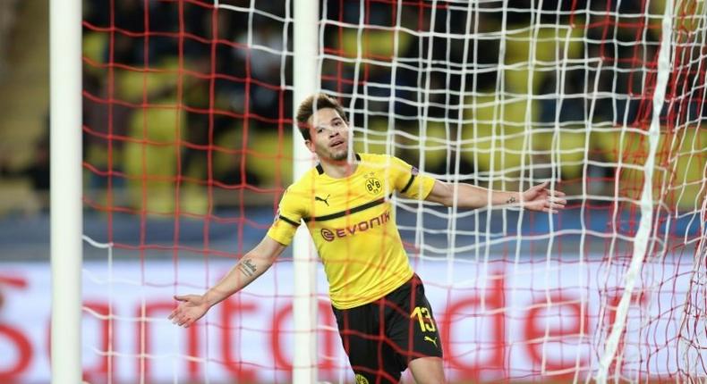 Raphael Guerreiro scored twice to clinch Borussia Dortmund top spot in their group