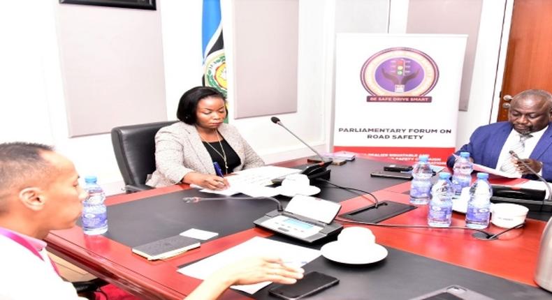 WHO's Dr Nhan Tran (L), Parliamentary Commissioner, Hon. Esther Afoyochan and Hon. Alex Ruhinda at the meeting at Parliament