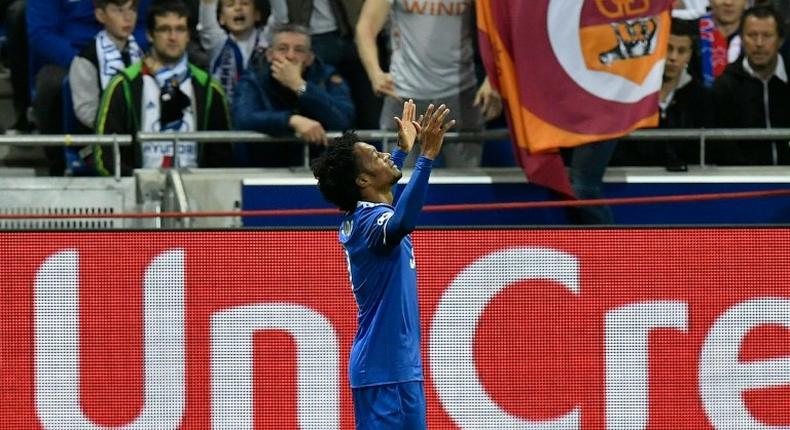 Juventus' Juan Cuadrado celebrates after scoring a goal against Olympique Lyonnais on October 18, 2016 in Decines-Charpieu near Lyon, southeastern France