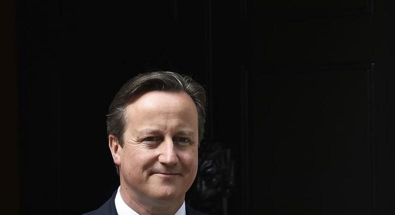 Britain's Prime Minister David Cameron waits to greet his Ukrainian counterpart Arseniy Yatsenyuk at Number 10 Downing Street in London, Britain July 15, 2015.  REUTERS/Toby Melville