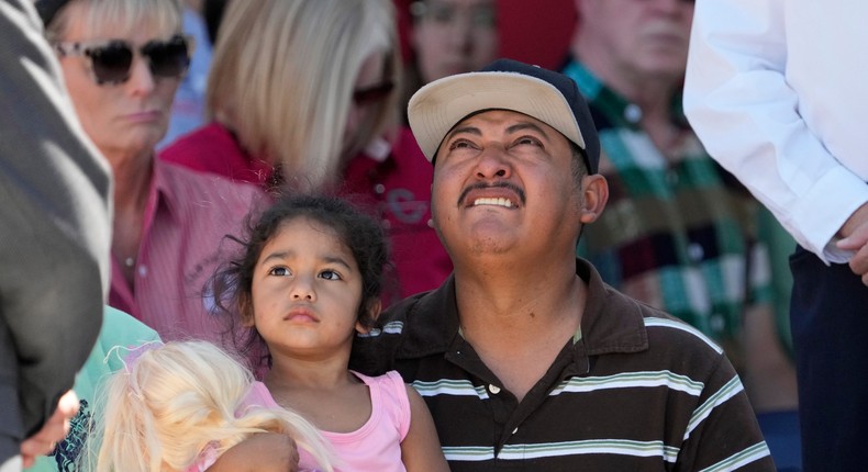 Shooting survivor Wilson Garcia looks up to the sky during a vigil on Sunday, April 30, 2023.AP Photo/David J. Phillip