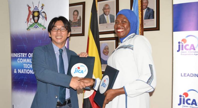 Aminah Zawedde, PS for Ministry of ICT poses for a picture with Uchiyama Tukayuki, chief representative of JICA