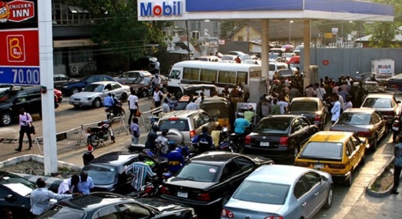 Car owners queuing at a petrol station in Nigeria