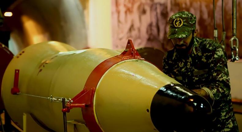 A picture released on March 8, 2016 by Sepah News, the public relations arm of Iran's Revolutionary Guards, shows a member of the Guards next to a missile launcher in an underground tunnel