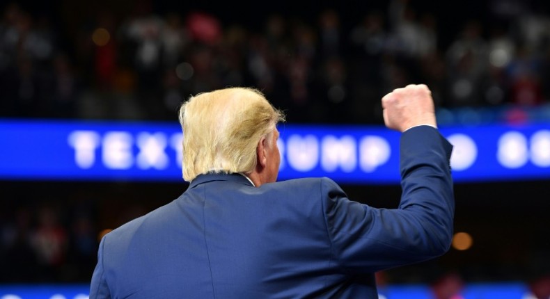 US President Donald Trump is seen speaking at a rally in Dallas, Texas, on October 17, 2019, during one of his most difficult weeks in office