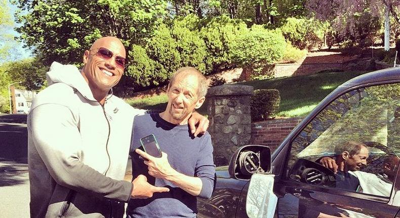 Dwayne 'The Rock' Johnson poses with Audie Bridges after bashing his truck's side mirror on his way to movie set