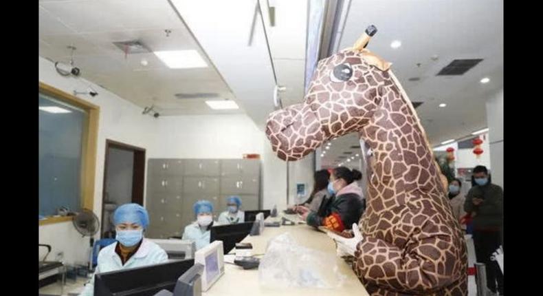 Woman visits hospital wearing giraffe costume as protection from Coronavirus