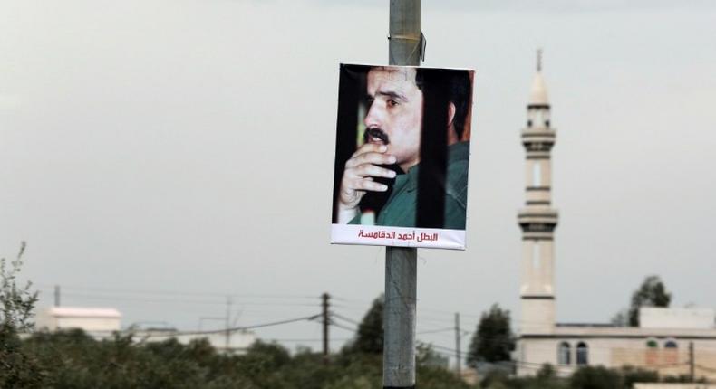 A portrait of Ahmad Dakamseh hangs in the Jordanian city of Irbid on the day of his release after serving 20 years in prison