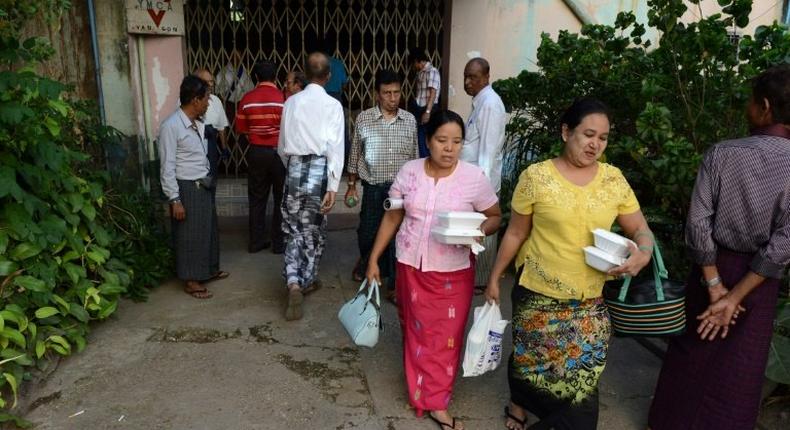 Myanmar Muslim devotees depart a private meeting hall after hardline Buddhist nationalists stopped a Muslim ceremony on January 8, 2017