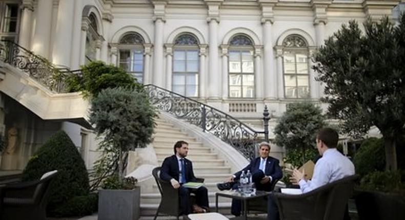 U.S. Secretary of State John Kerry (C) and State Department Chief of Staff Jon Finer (L).