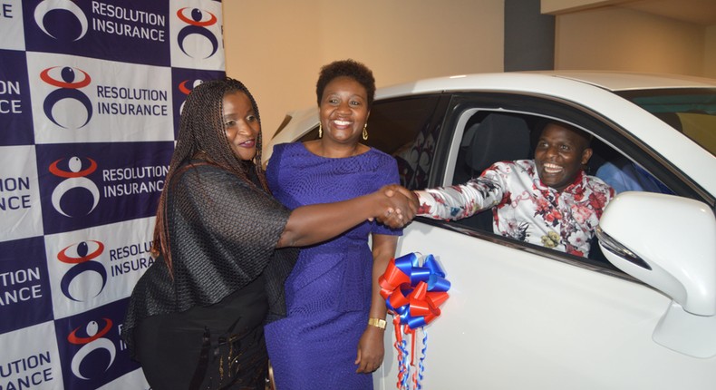 Damaris Ngare (L) congratulates Mr. Lameck Nyasetia of Platinum Micro-insurance Brokers as Resolution MD Ms. Alice Mwai (C) looks on. Platinum Micro-insurance Brokers scooped the overall winners prize (Lexus RX270) during the Resolution Agent Awards held on 15th March 2019 at the Movenpick Hotel Nairobi.