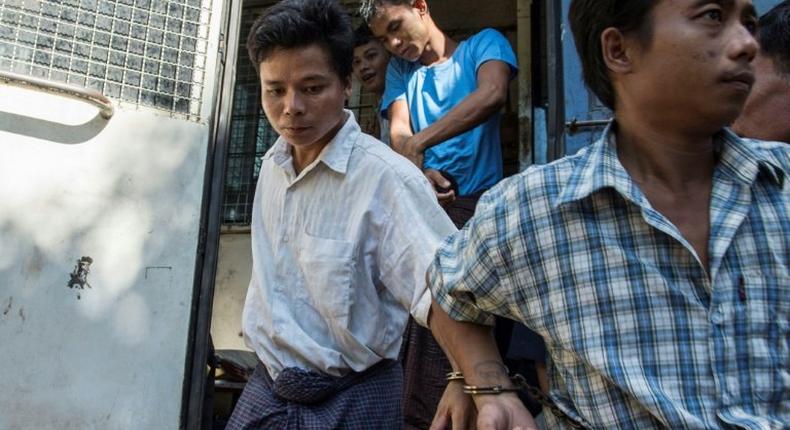 Tun Naing (left) arrives at a Yangon court compound on November 18, 2016