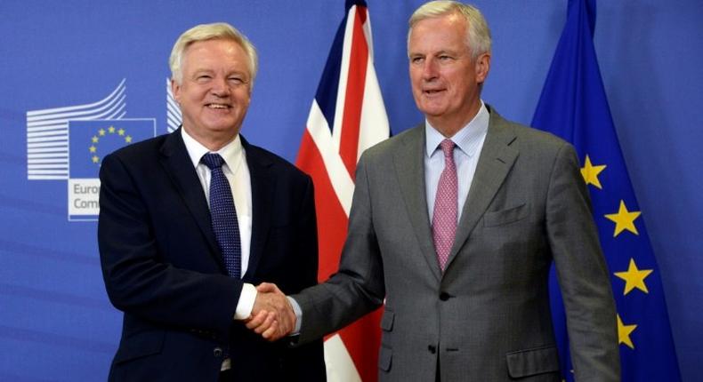 British Brexit minister David Davis (L) attracted criticism for leaving for London after a brief meeting with Michel Barnier