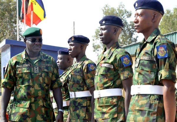 Nigerian Army Lieutenant General and the current Chief of Army Staff of Nigeria, Tukur Yusuf Buratai inspects a guard of honor (Vanguard)