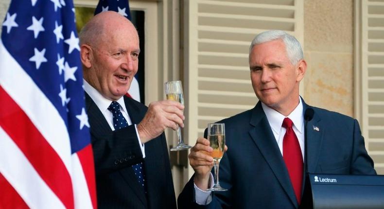 US Vice President Mike Pence (R) and Australia's Governor General Peter Cosgrove toast each other during a lunch reception in Sydney