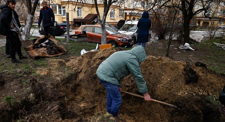 People seen digging graves in Bucha, Ukraine, on April 5, 2022.