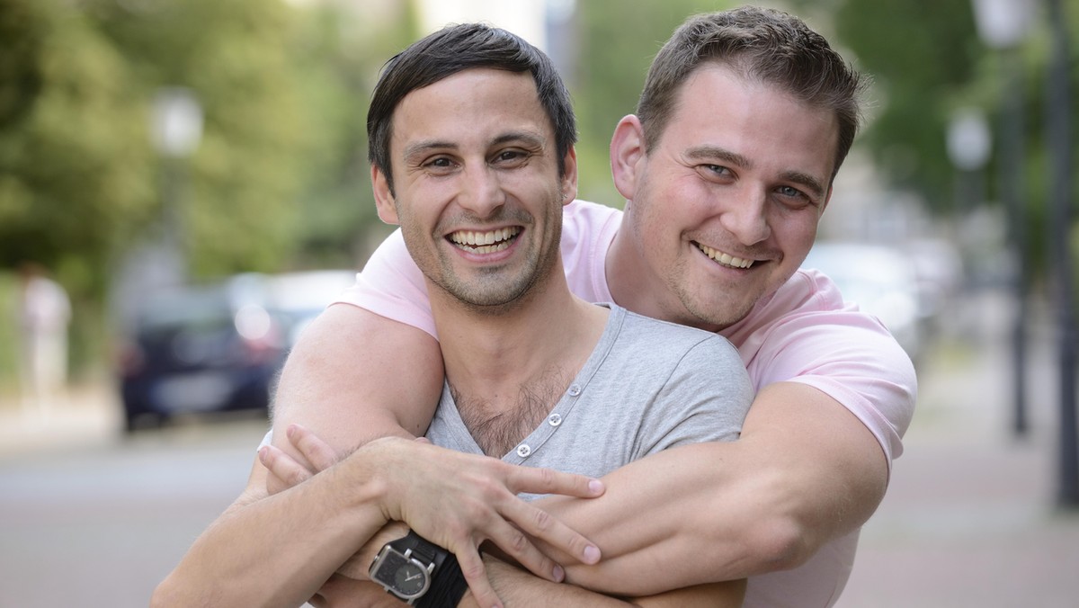 Happy gay couple outdoors