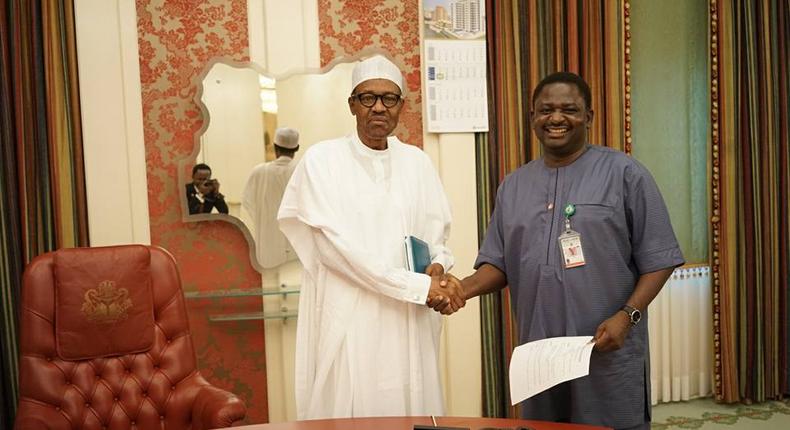 Femi Adesina and President Buhari (Premium times)