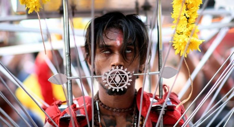 A Malaysian Hindu devotee walks in a trance towards the Batu caves temple during the Thaipusam festival celebrations in Kuala Lumpur