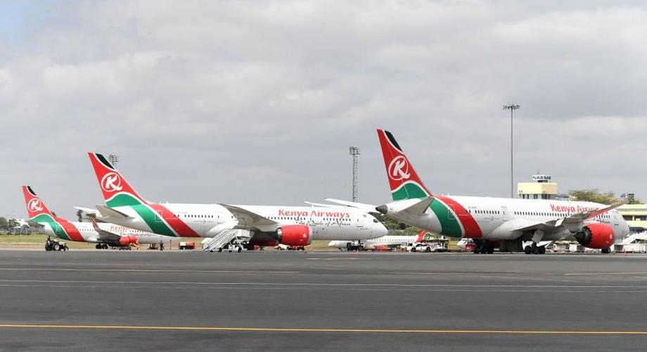 A picture taken on August 1, 2020 shows Kenya Airways planes parked at the parking bay at the Jomo Kenyatta international airport in Nairobi as Kenya Airways airline resumed flights to Britain after flights had been canceled during the COVID-19 (novel coronavirus) pandemic outbreak. (Photo by SIMON MAINA/AFP via Getty Images)
