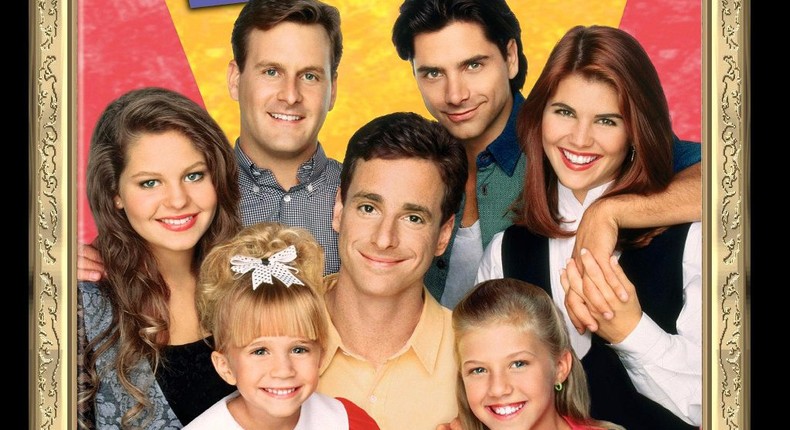 The Full House cast, from left, Candace Cameron-Bure, an Olsen twin, Dave Coulier, Bob Saget, John Stamos, Jodie Sweetin, and Lori Loughlin.