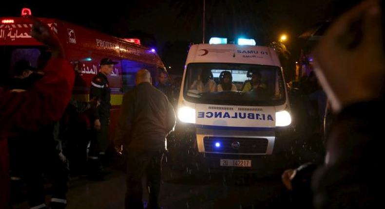 Police help to make way for an ambulance carrying bodies after an attack on a military bus in Tunis, Tunisia November 24, 2015. 