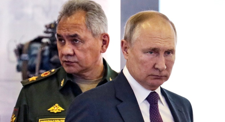 Russian President Vladimir Putin, right, and Russian Defense Minister Sergei Shoigu attend the launch of the construction of new nuclear submarines and other warships via video conference on the side of the International Military Technical Forum Army-2021 in Alabino, outside Moscow, Russia, Monday, Aug. 23, 2021.