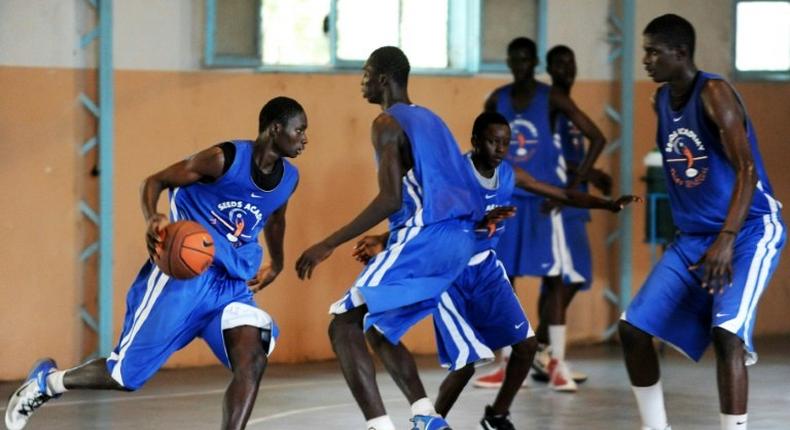 Student athletes at the SEEDS Academy (Sport for Education and Economic Development), a free basketball-focused boarding school in Thies, Senegal, take part in a practice session, on November 28, 2012