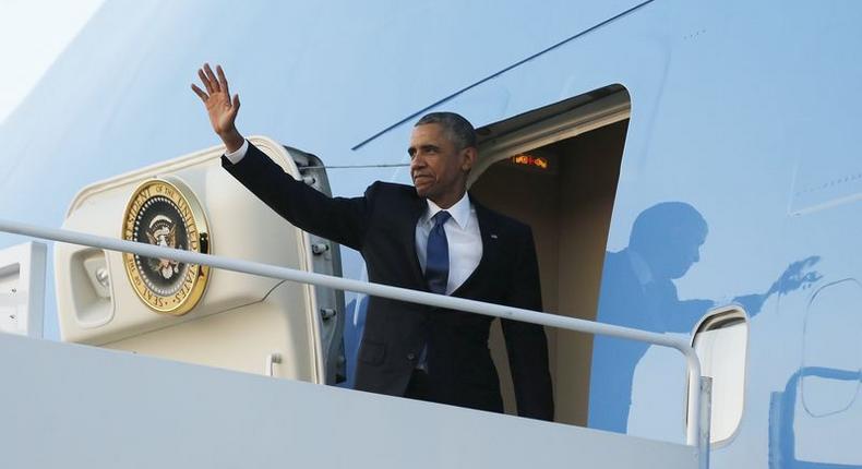 U.S. President Barack Obama waves as he boards Air Force One for travel to Kenya and Ethiopia from Joint Base Andrews, Maryland July 23, 2015 REUTERS/Jonathan Ernst