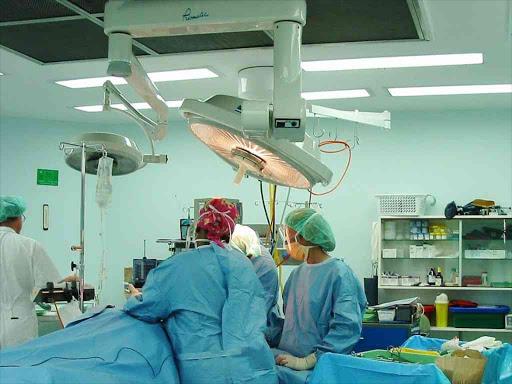 A surgery in progress in a hospital theatre