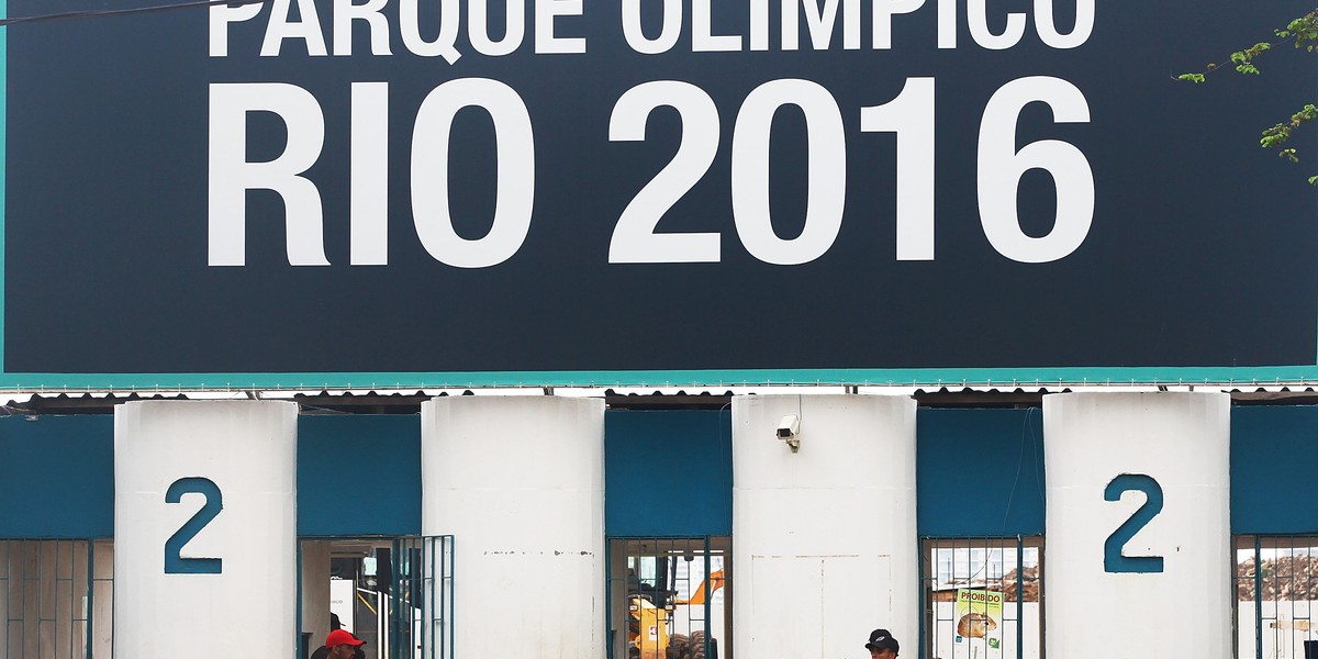 A security guard keeps watch at the entrance to Olympic Park, the primary set of venues being built for the Rio 2016 Olympic Games.