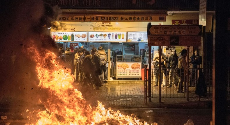 Ray Wong and Alan Li are wanted for riot charges relating to Lunar New Year clashes in February 2016, when protesters hurled bricks torn up from pavements and set rubbish alight in the commercial district of Mong Kok