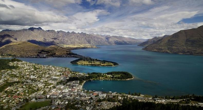 Views like this -- of Queenstown and Lake Wakatipu, with the Remarkables mountain range in the background -- are one of the reasons tourists flock to New Zealand. But strong economic growth is placing strains on the environment, the OECD is warning